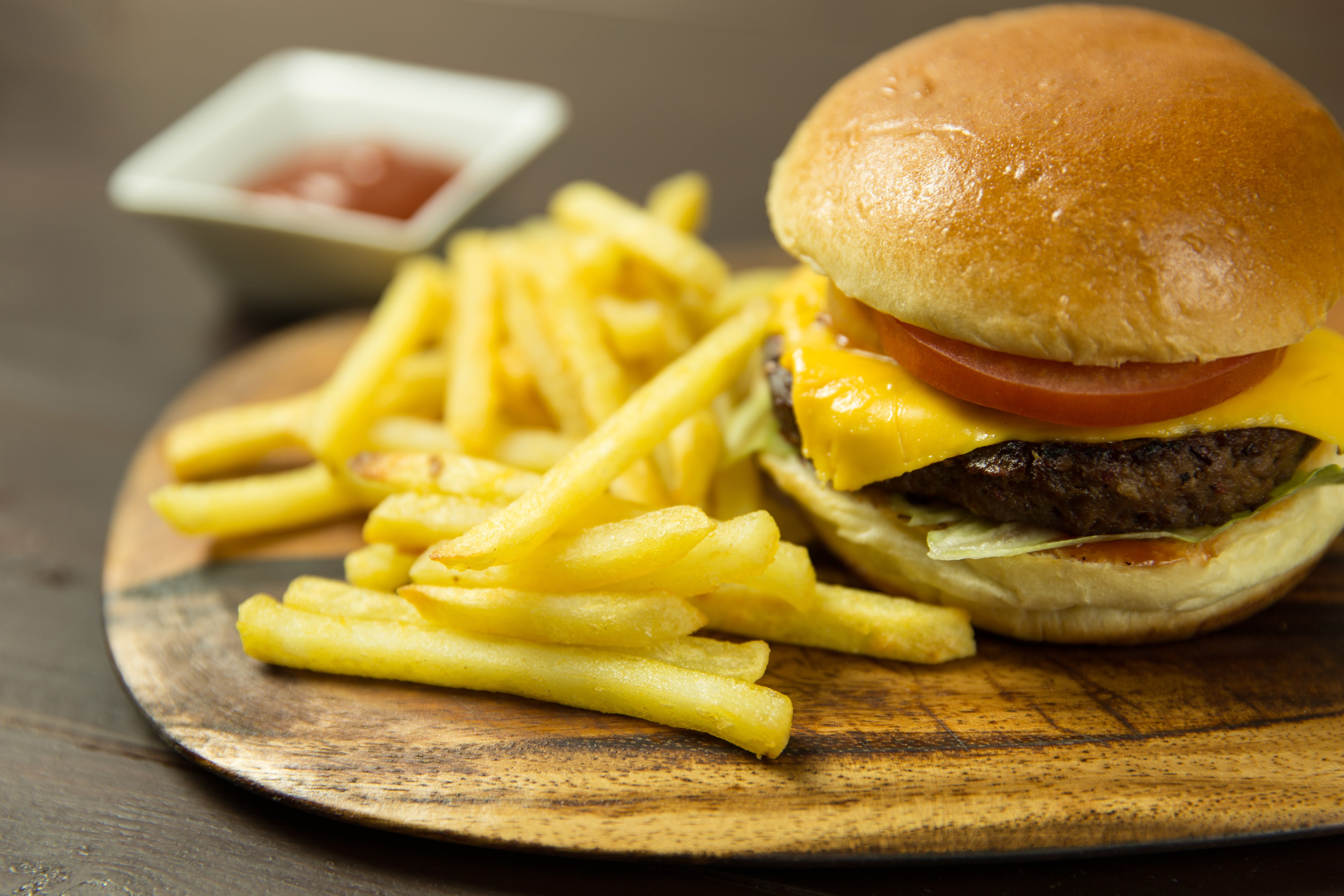 Classic Burger - Juicy beef patty topped with fresh lettuce, tomatoes, and cheese